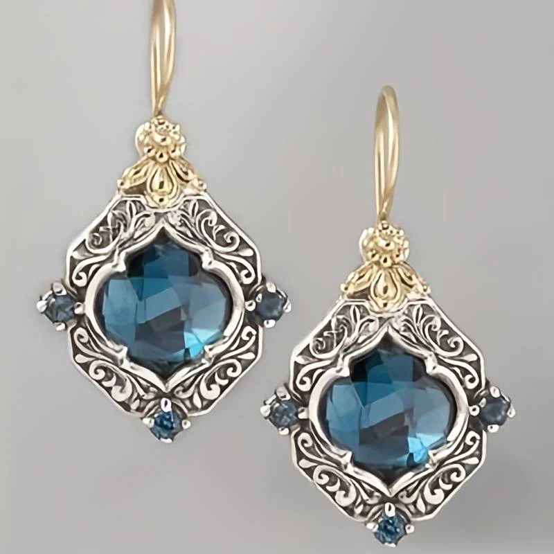 Boucles d'oreilles vintage en or et argent avec cristaux bleus